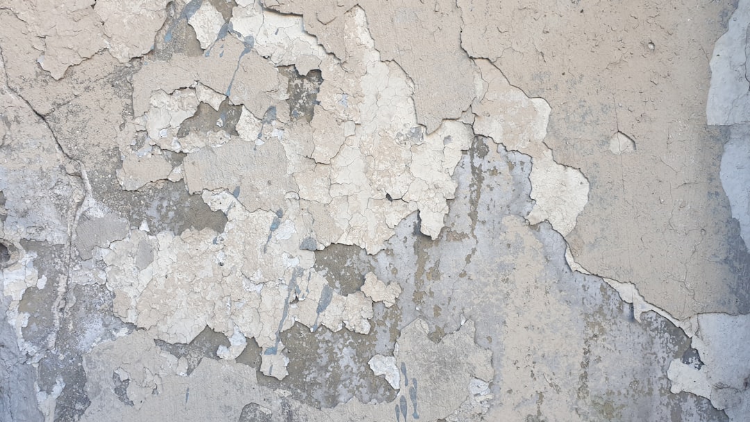 Cracked and weathered stucco wall