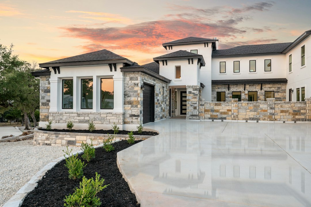 Modern stucco home exterior at sunset